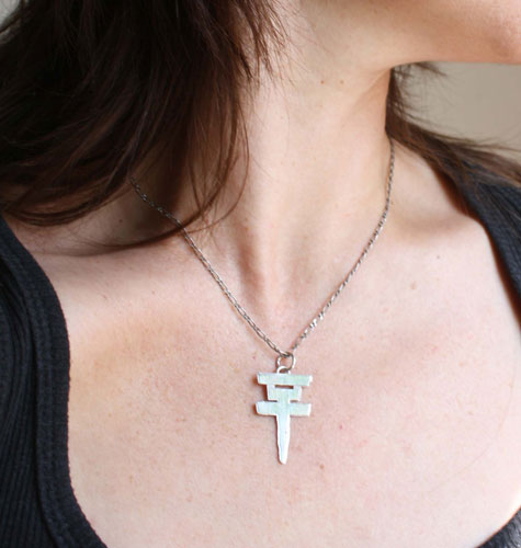 Tokio Hotel, the pop rock band’s cross logo pendant in sterling silver