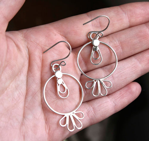 Toltec sun, pre-Hispanic earrings in silver