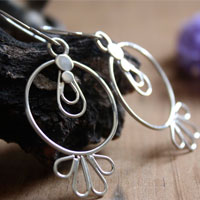 Toltec sun, pre-Hispanic earrings in silver