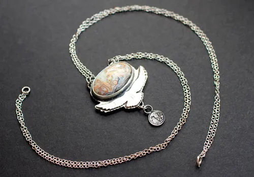 Unfold your wings, eagle bearing a moon necklace in silver and Mexican Crazy Lace agate