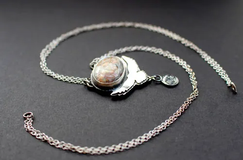 Unfold your wings, eagle bearing a moon necklace in silver and Mexican Crazy Lace agate