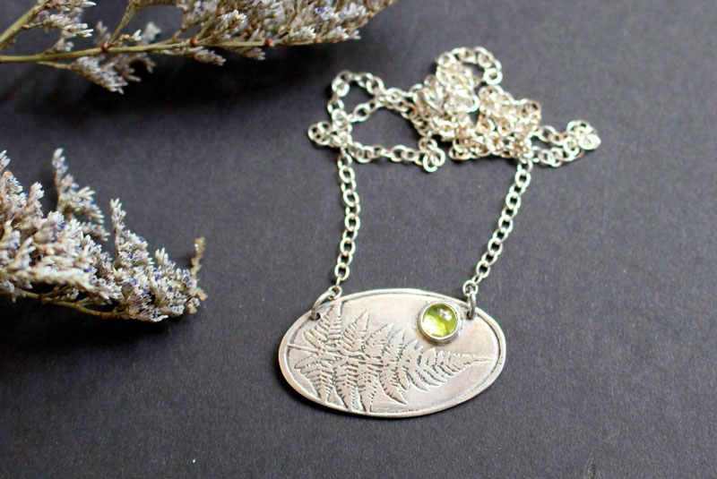 Undergrowth perfume, fern sterling silver necklace and peridot