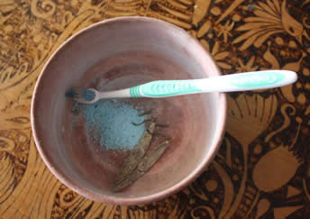 Silver jewelry cleaning with detergent and brush tooth