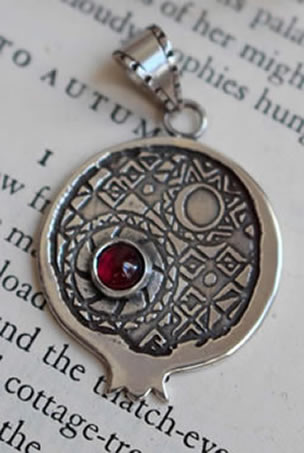 Persephone with pomegranate pendant imagined with a garnet for a client