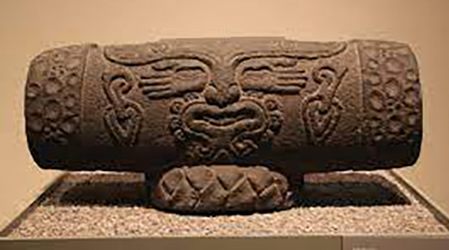 Teponaxtle or Aztec drum with the god of music Xochipilli