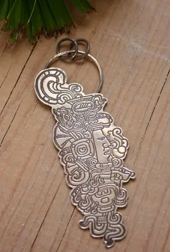Quiquiztli pendant that shows the face of a Maya ruler