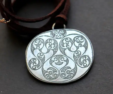 The Desborough Mirror necklace, crafted from the back of the famous English Celtic mirror.
