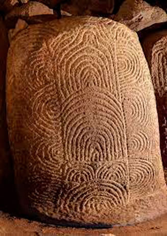 One of the stones in the corridor of the Cairn of Gavrinis with these spiral patterns