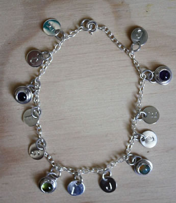 The tree of Jesse bracelet, with the birthstones and initials of each family member