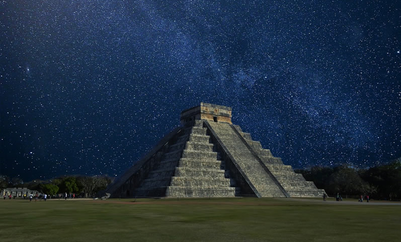 The Mayan pyramid of Kukulkan from the site of Chichen Itza, Mexico, under the starry night. The same stars observed by the Mayan priests to develop their calendar.