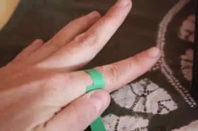 Measuring a finger with a paper strip