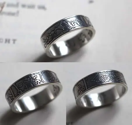 Custom ring with three engraved landscape designs