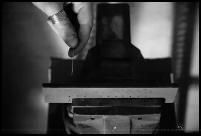 Passage of the sterling silver wire to the draw plate
