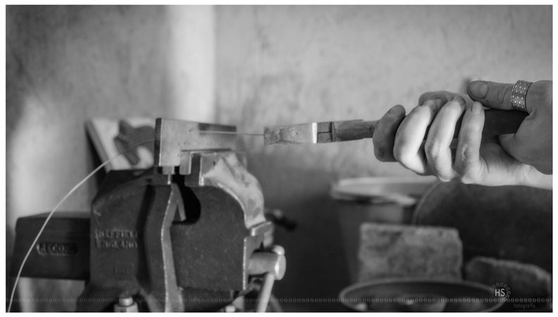 Passage of the sterling silver wire to the draw plate