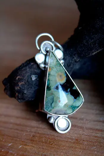 Quetzalcoatl handmade silver pendant with rainforest jasper