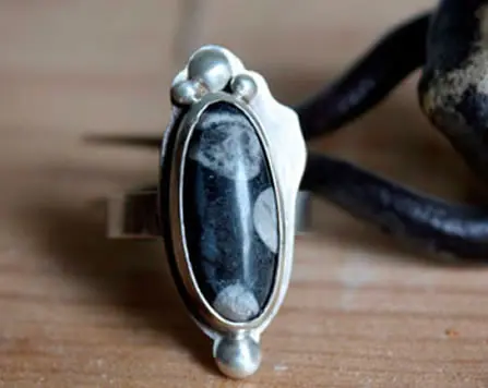 Artisanal Tulen ring with a snowflake obsidian cabochon, handmade jewelry